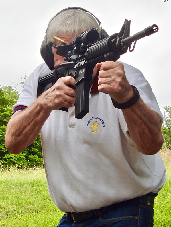 Thompson fires FN 15 Military Collector M4 at hanging plates at 50 yards.